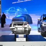 Deepal's Super Integrated E Drive electric powertrain unit displayed on a blue stand at Bangkok International Motor Show 2025, with 'TOUCH THE FUTURE' backdrop