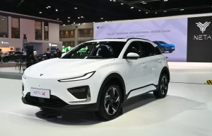 NETA Auto Thailand's Resilience Tested 1 Neta X electric SUV displayed at Bangkok International Motor Show, featuring a sleek white exterior design with the Neta logo visible in the background booth