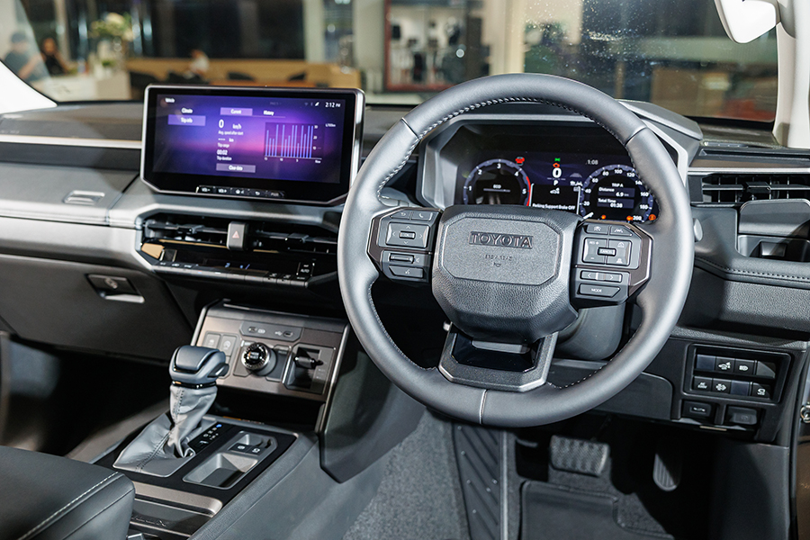 Toyota Hilux Travo Launches in Thailand: Key Specifications, Pricing, and Market Implications 3 Interior of the Toyota Hilux Travo Overland showing the digital instrument cluster, multifunction steering wheel, and large central infotainment display