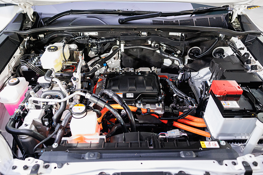 Toyota Hilux Travo Launches in Thailand: Key Specifications, Pricing, and Market Implications 7 Toyota Hilux Travo-e electric powertrain bay showing high-voltage components, cooling systems, and EV control modules.